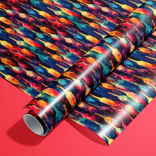 A roll on an unrolled sheet of Vibrant Ink Bottles wrapping paper featuring watercolor wine bottles in jewel tones on deep navy, set on a bright red background.