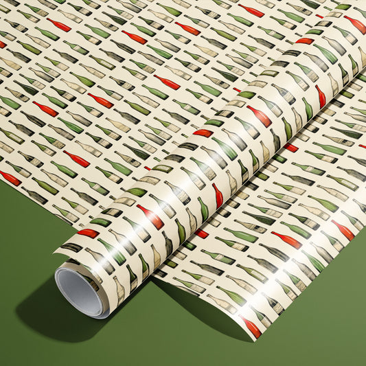 A roll on an unrolled sheet of Classic Vino wrapping paper with watercolor wine bottles in green, red, and clear on cream, set on an olive green background.