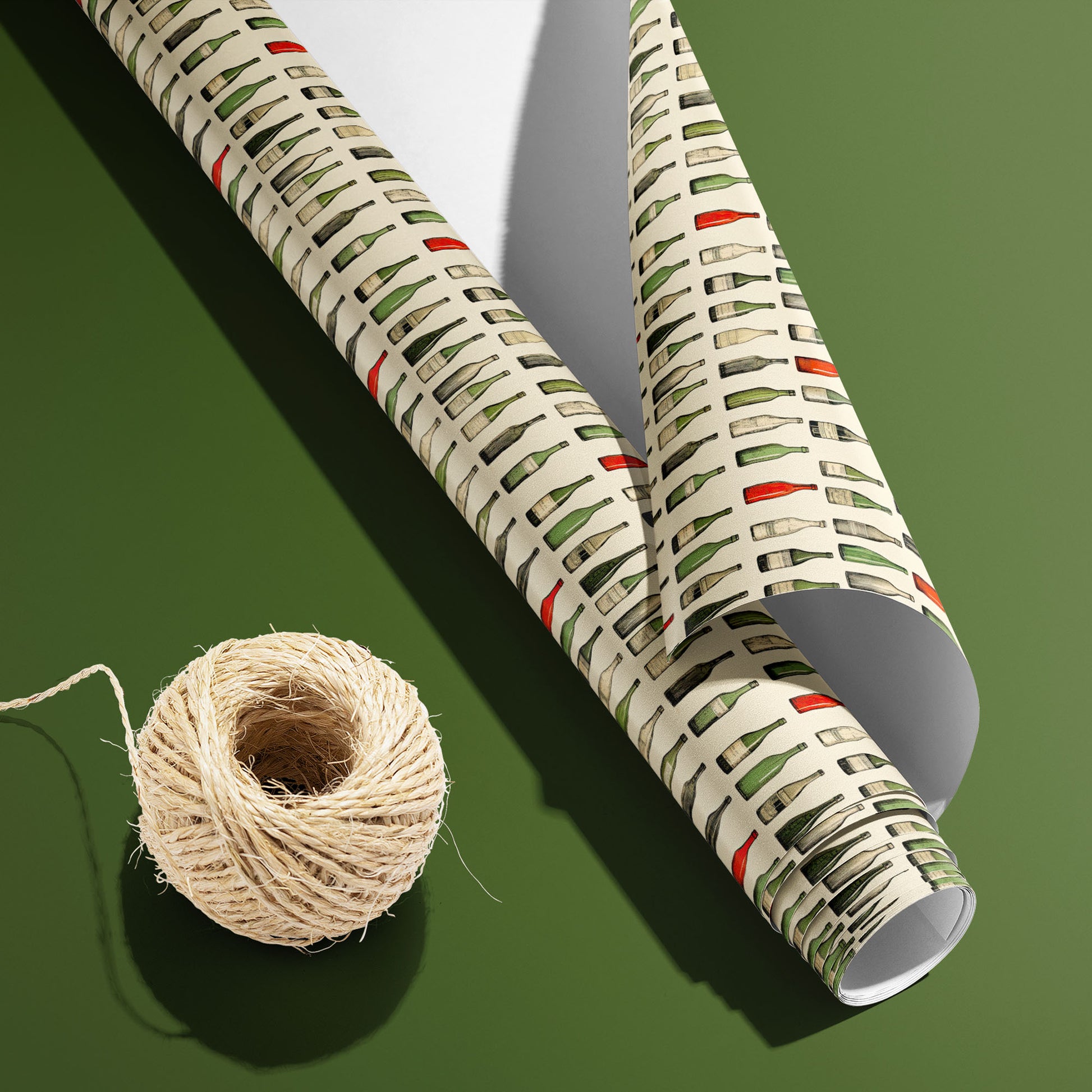 A partially unfurled Classic Vino roll with the white underside visible beside a spool of natural twine, featuring watercolor wine bottles on an olive green surface.