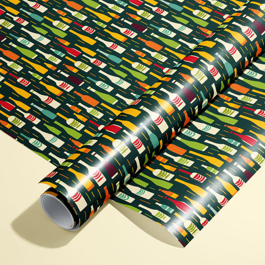 A roll of Wine Bottle Silhouettes rests on a matching unrolled sheet, featuring multicolor bottle icons on deep green, on a cream background.