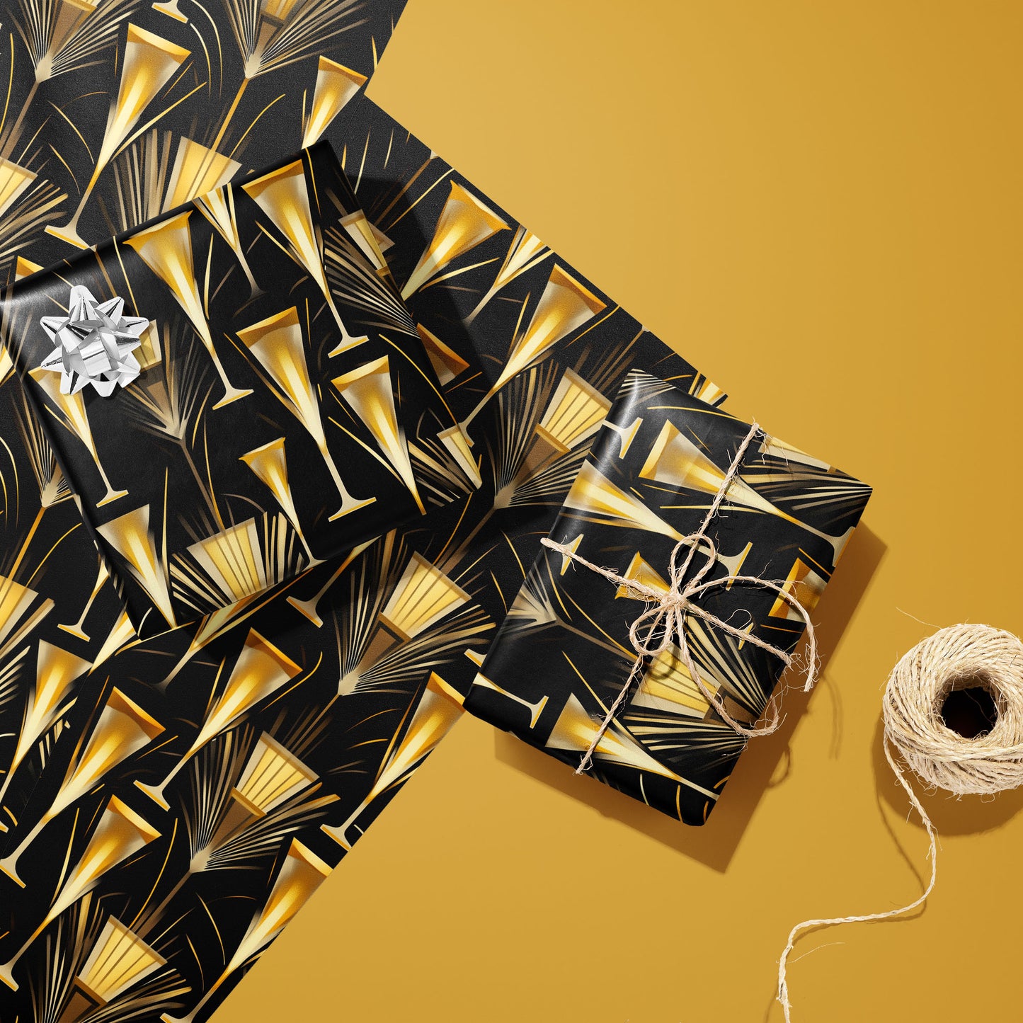 Two gifts wrapped in Flutes & Fans—one with a silver bow and one tied with twine—rest on two unused sheets beside a twine spool on a gold background with gold fans and flutes.