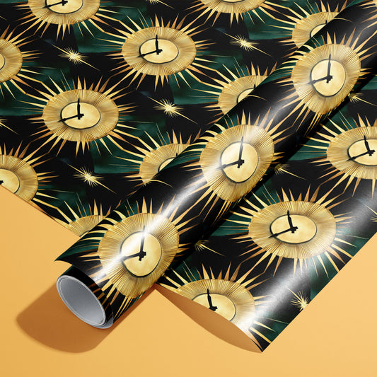 A roll on an unrolled sheet of Sunburst Clocks wrapping paper with mid-century gold sunburst clock faces on black with deep green patterns, set on a warm ochre background.