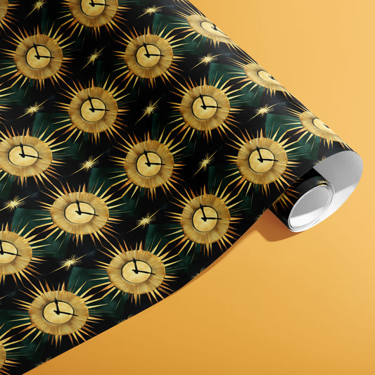 A partially unfurled roll of Sunburst Clocks wrapping paper showing gold-rayed clock motifs on a black field with green patterns on a warm ochre background.