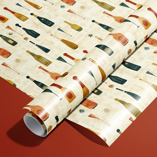 A roll of Vintage Bubbly rests on a matching unrolled sheet, featuring mid-century champagne bottles, coupes, and starbursts on a cream ground over a brick-red surface.