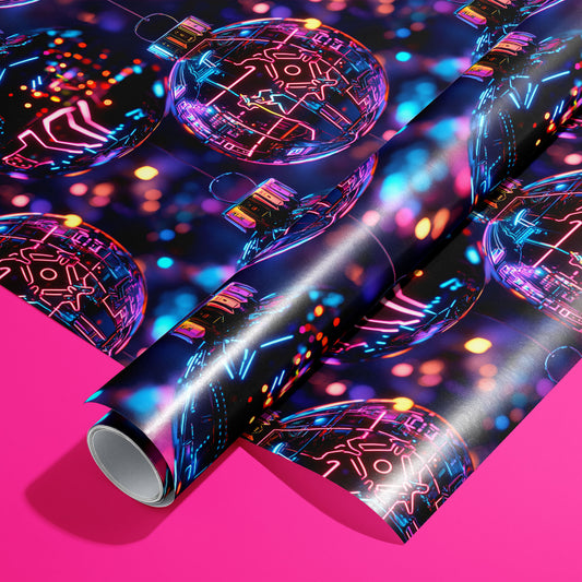 A roll of Chrome City Christmas rests on an unrolled sheet, showing chrome baubles with neon circuit lines and city lights on deep navy, styled on a hot pink surface.