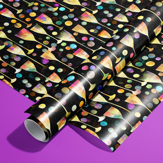 A roll of Radiant Revelry paper on a matching unrolled sheet shows iridescent champagne flutes and multicolor bubbles on black, photographed on a vibrant purple background.
