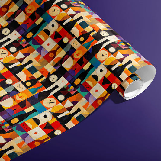 A partially unfurled roll of Geometric Cheer wrapping paper reveals colorful abstract shapes, bottles, and clocks arranged in a grid, photographed on a purple background.