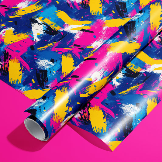 A roll of Electric Splash paper on a matching unrolled sheet shows neon magenta, yellow, and cobalt paint strokes with black dashes and white splatters on a hot pink background.