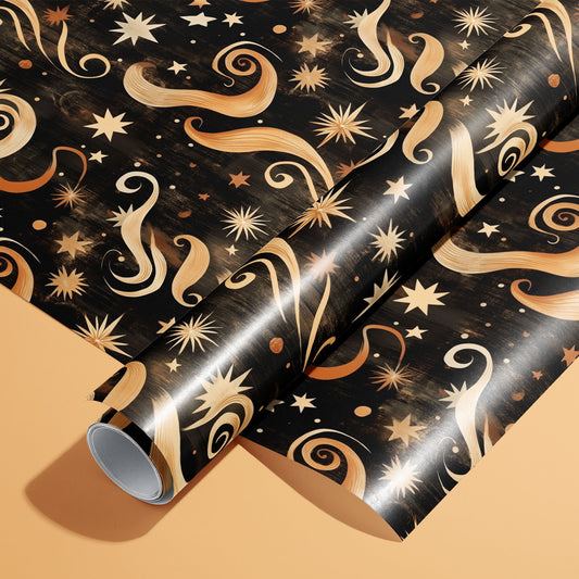 A roll of Golden Stardust wrapping paper resting on an unrolled sheet, with swirling comet motifs and gold stars, on a warm peach background.