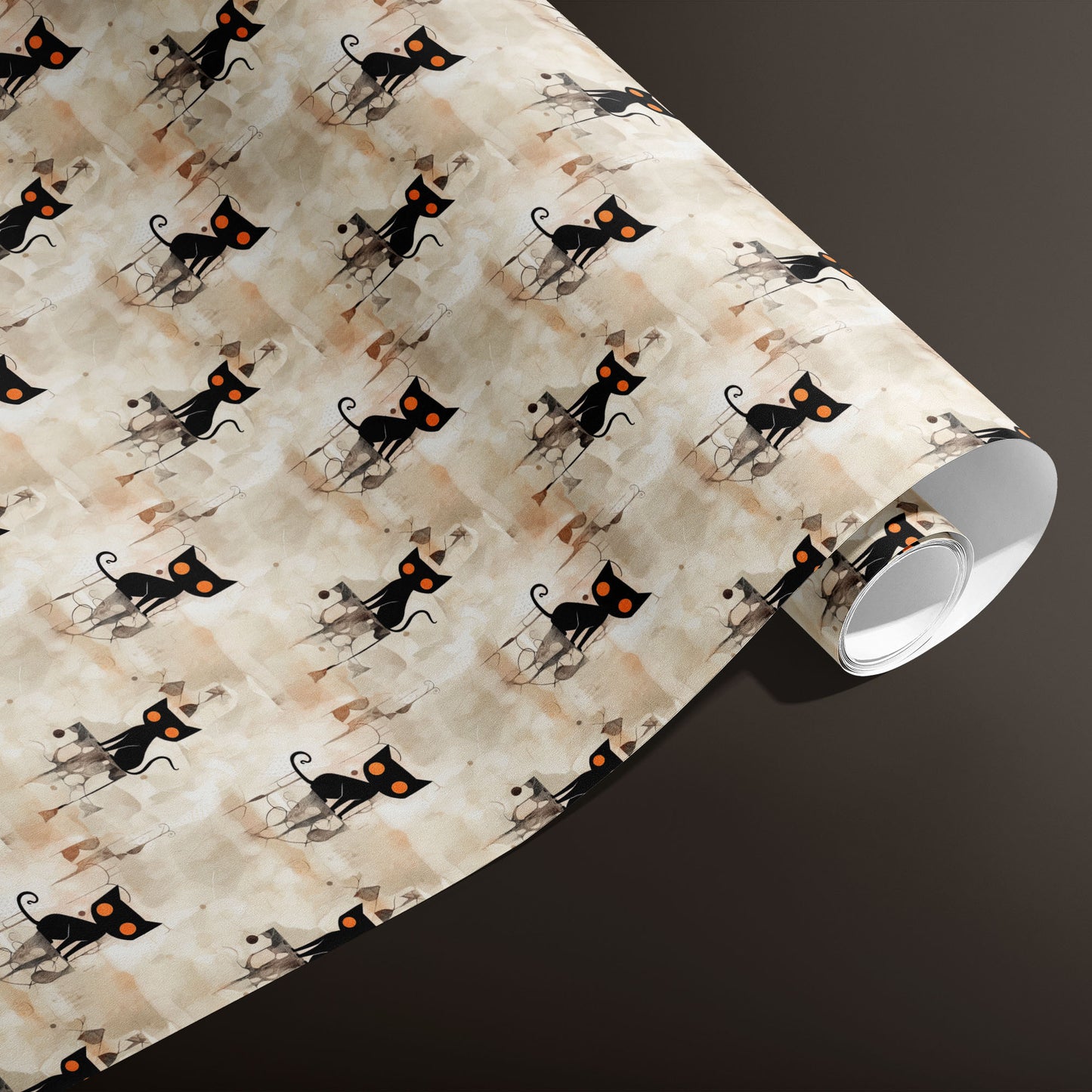 A partially unfurled roll of Contemporary Black Cats wrapping paper reveals stylized black cats with orange eyes atop a beige watercolor wash on a deep espresso background.