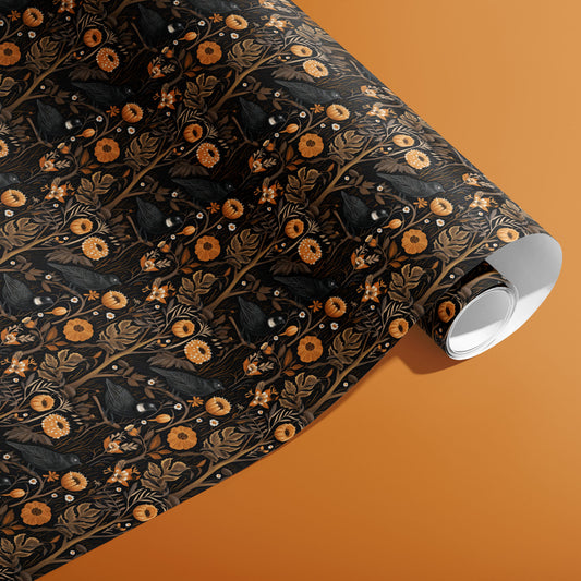 A partially unfurled roll of Autumn Floral wrapping paper showing rich autumn blossoms and foliage in orange, gold, and wine tones on a warm rust surface.
