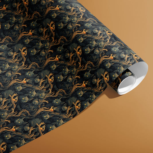 A partially unfurled roll of Midnight Prowlers giftwrap showing shadowy cats and twisting woodland branches, resting on a caramel-brown surface.