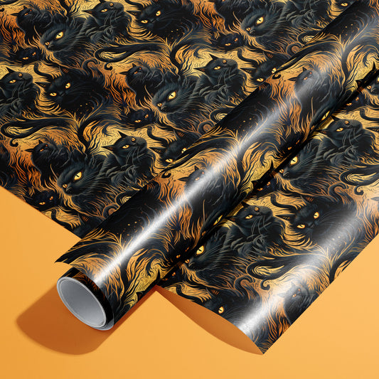 A roll of Feline Flames rests on a matching unrolled sheet, featuring black cats with ember-bright eyes amid swirling fire-like fur on a dark ground, on a pumpkin-orange surface.