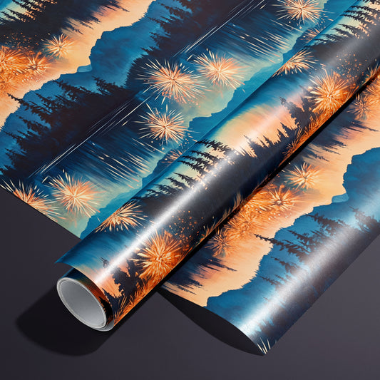 A roll of Radiant Reflections rests on a matching unrolled sheet, featuring fireworks over a mountain lake with pine silhouettes and glowing water reflections on a charcoal-purple surface.