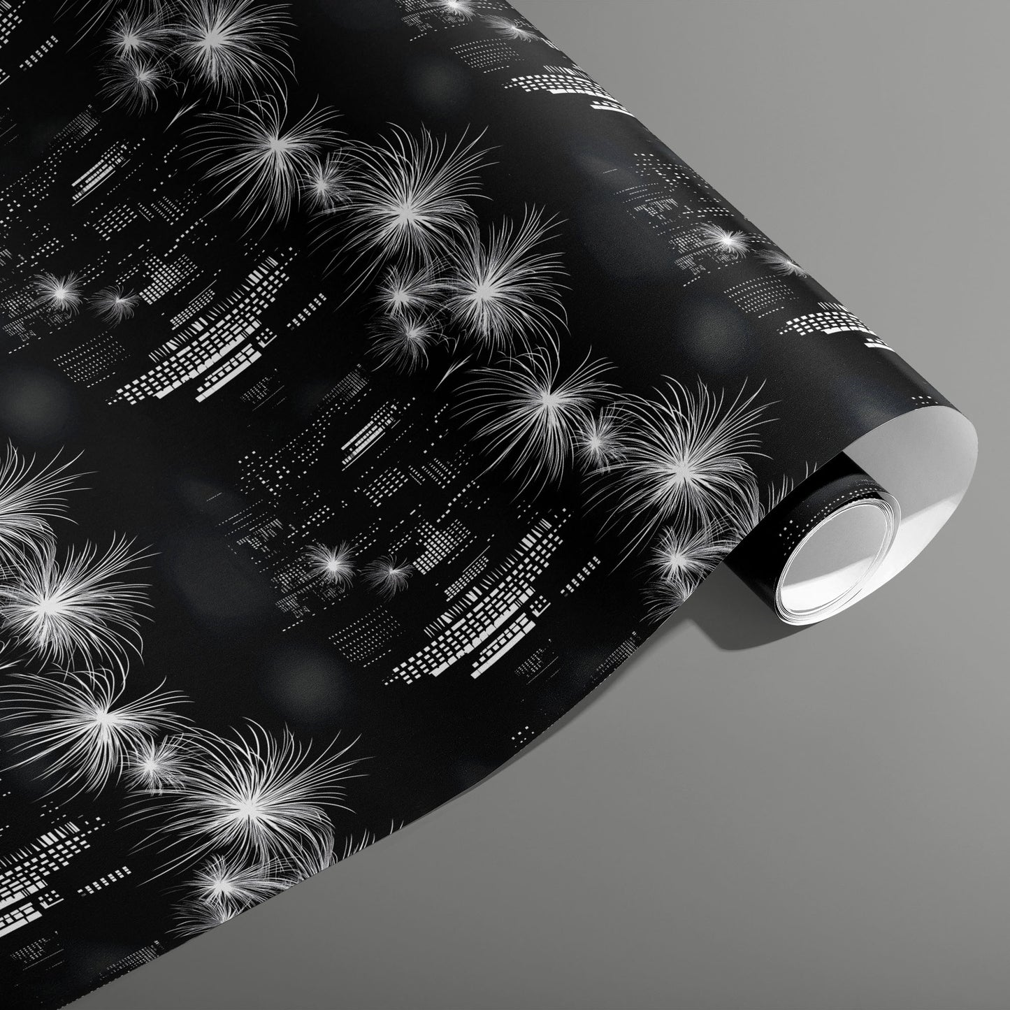 A partially unfurled roll of Skyline Magic featuring monochrome skyscraper lights and bursting fireworks on a black ground, set on a medium gray background.