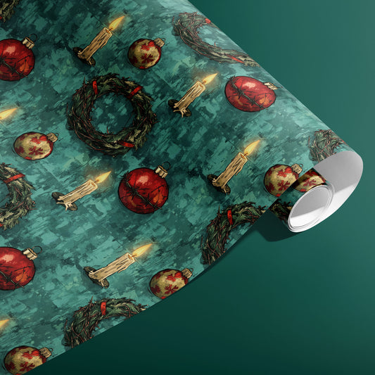 A partially unfurled roll of A Dystopian Christmas showing red baubles wrapped in barbed wire, thorny wreaths, and waxy candles across a mottled teal background on deep green.