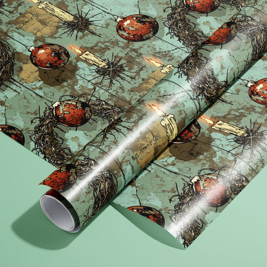 A roll of Tarnished Spirit rests on a matching unrolled sheet, featuring distressed teal panels with twig wreaths, dripping candles, and red ornaments on a mint green surface.