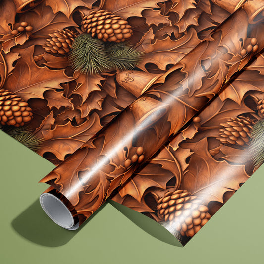 A roll of Timberland Treasures wrapping paper on an unrolled sheet, featuring woodcarved-style oak leaves, pinecones, berries, and bells in warm browns on a sage green surface.