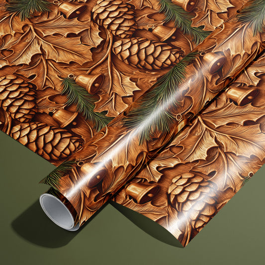A roll of Pinewood Bells rests on an unrolled sheet, showing carved-wood bells, pinecones, oak leaves, and fir sprigs in warm browns, styled on an olive green surface.