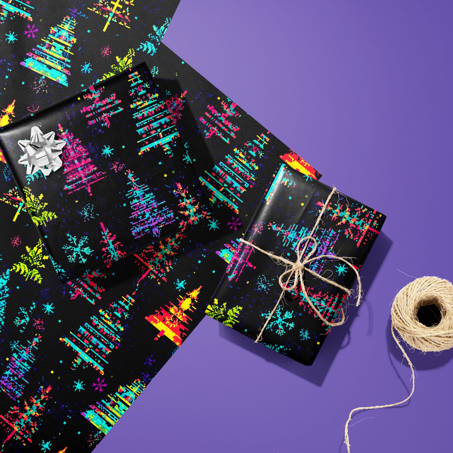 Two Glitchmas Trees gifts—one with a silver bow and one tied with twine—rest on two unused sheets beside a twine spool on an electric purple surface, showing pixel-shifted trees.
