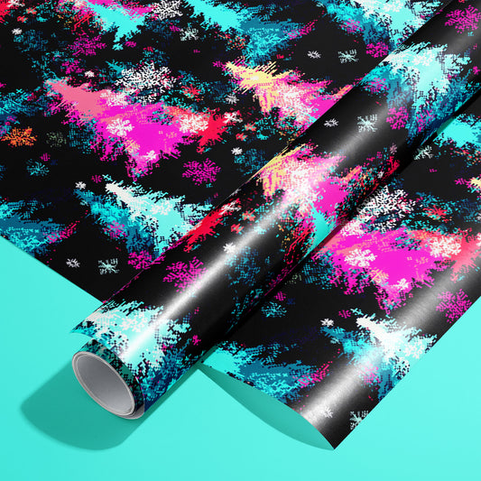 A roll of Pixel Pines wrapping paper on an unrolled sheet, featuring 8-bit evergreen trees, ornaments, and snowflakes in bold retro colors, set on a soft teal surface.