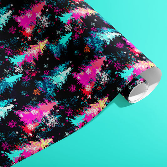 A partially unfurled roll of Pixel Pines wrapping paper with pixel-art pines, ornaments, and tiny snowflakes in bright holiday hues on a soft teal surface.