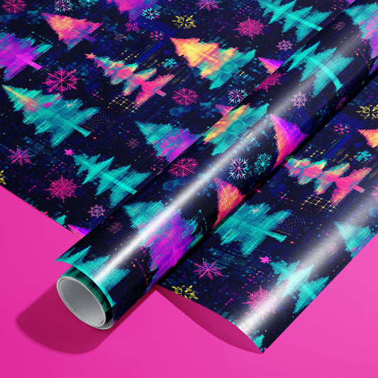 A roll of Electric Evergreen wrapping paper resting on a matching unrolled sheet, featuring neon glitch-style Christmas trees and snowflakes on deep navy, set on a hot pink background.