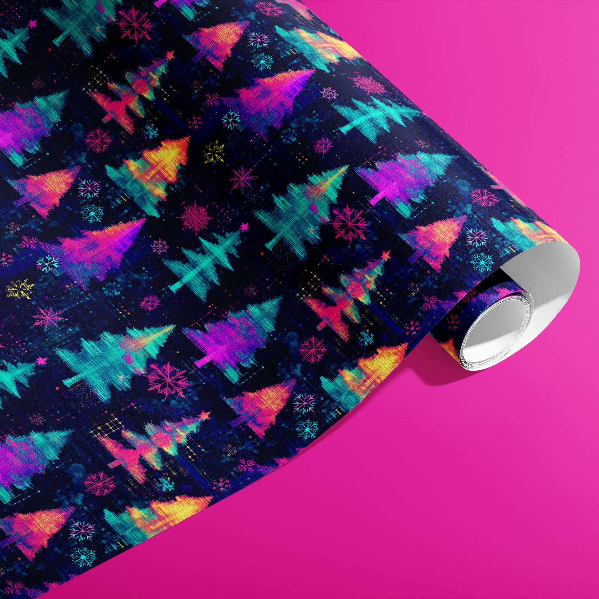 A partially unfurled roll of Electric Evergreen wrapping paper printed with neon Christmas trees and snowflakes in a digital-glitch style on deep navy, shown on a hot pink surface.