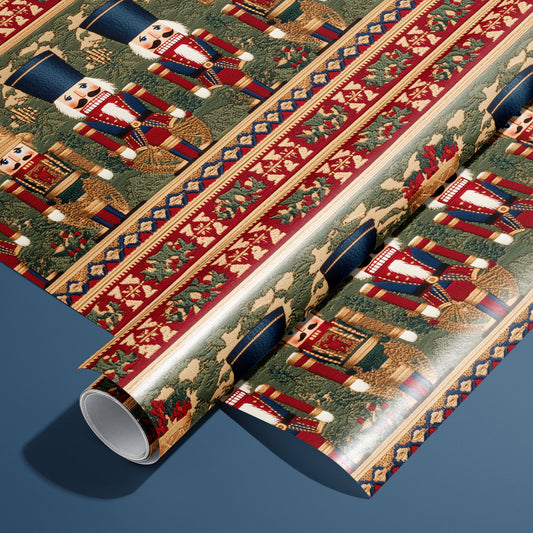 A roll of Regal Nutcrackers rests on an unrolled sheet, featuring tapestry-style nutcrackers, drums, and holly borders in red, gold, and green on a deep steel blue surface.