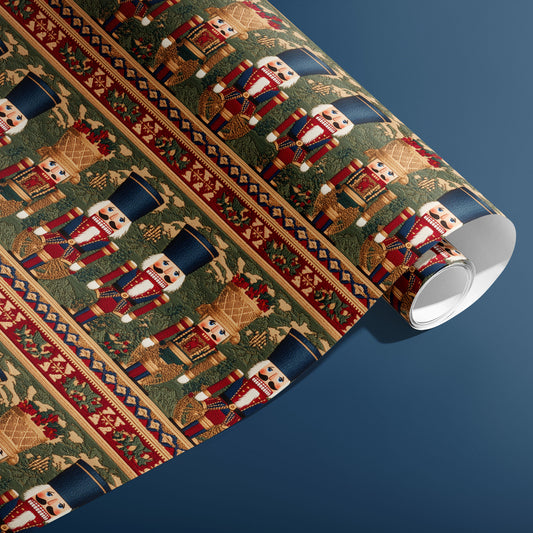 A partially unfurled roll of Regal Nutcrackers shows woven-look nutcrackers with holly and geometric borders in festive reds and golds against a deep steel blue background.