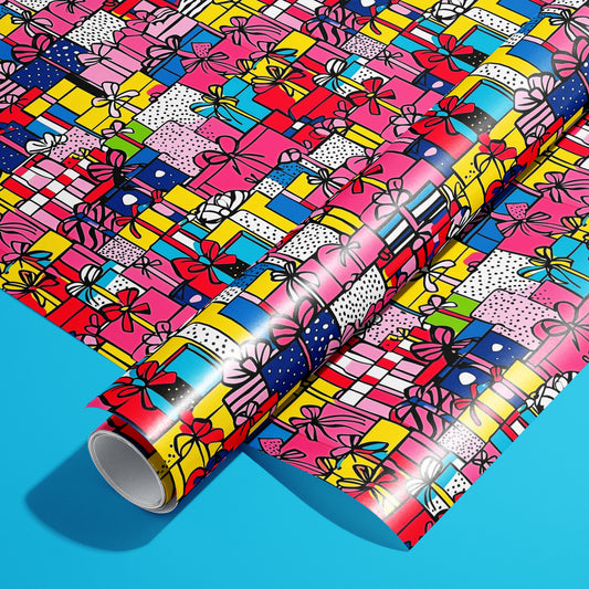 A roll of Pop Art Presents rests on an unrolled sheet, showing comic-style gift boxes with bold outlines, stripes, and halftone dots in vivid colors, styled on a bright cyan surface.