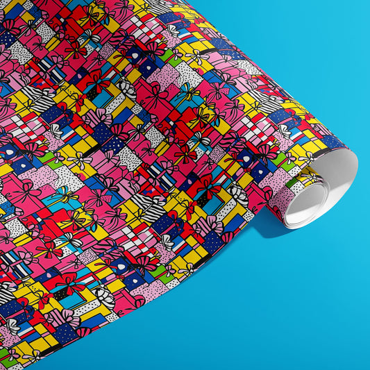 A partially unfurled roll of Pop Art Presents displays pop-art gift boxes with black outlines, stripes, and dots in pink, yellow, blue, and red against a bright cyan background.