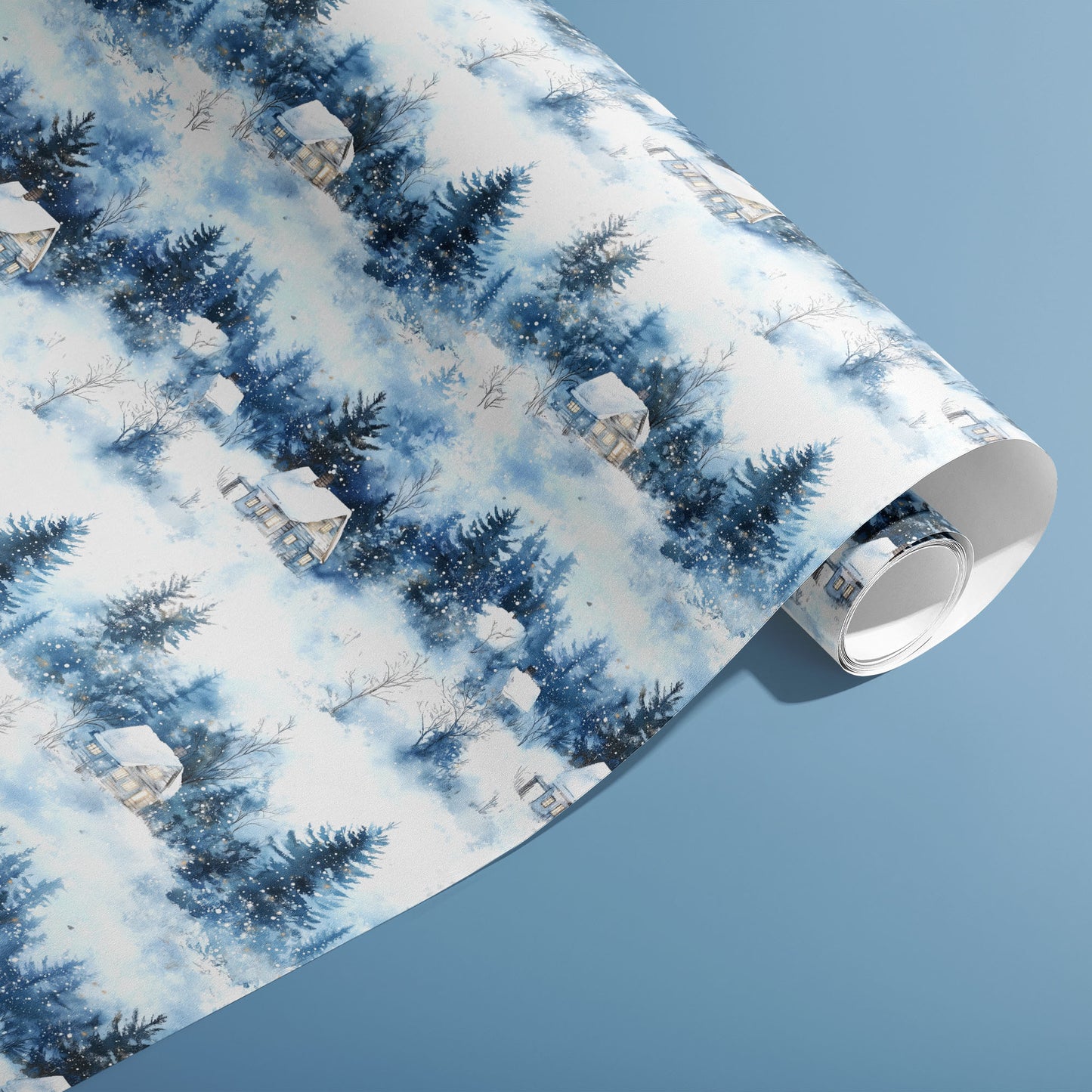 A partially unfurled roll of Winter's Calm wrap showcasing watercolor evergreens, cozy cabins, and falling snow on a dusty blue background.