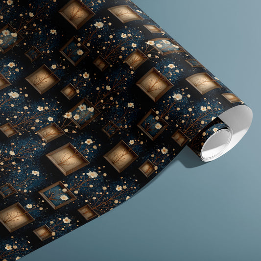 A partially unfurled roll of Curio Florarium gift wrap reveals its vintage frames and cream blossoms with gold branches on deep navy, styled against a muted teal background.