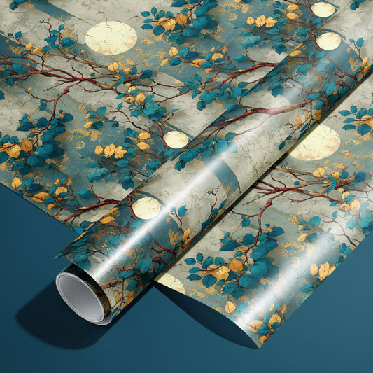 A roll of Verdigris Trellis wrapping paper rests on an unrolled sheet, showing climbing branches, teal and golden leaves, and moon medallions over an aged verdigris ground on a deep teal surface.