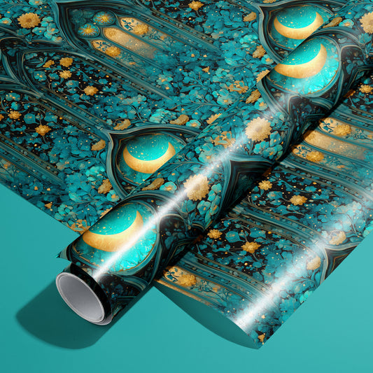 A roll of Wisteria Cathedral wrapping paper rests on a matching unrolled sheet, featuring gothic arches, teal stained glass moons, and gold floral vines on a teal background.
