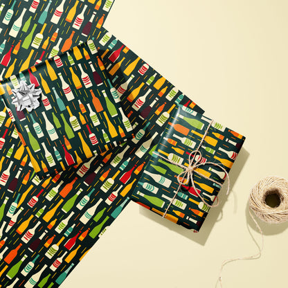 Two gifts in Wine Bottle Silhouettes—one with a silver bow and one tied with twine—rest on two unused sheets with multicolor bottle motifs on deep green beside twine on cream.