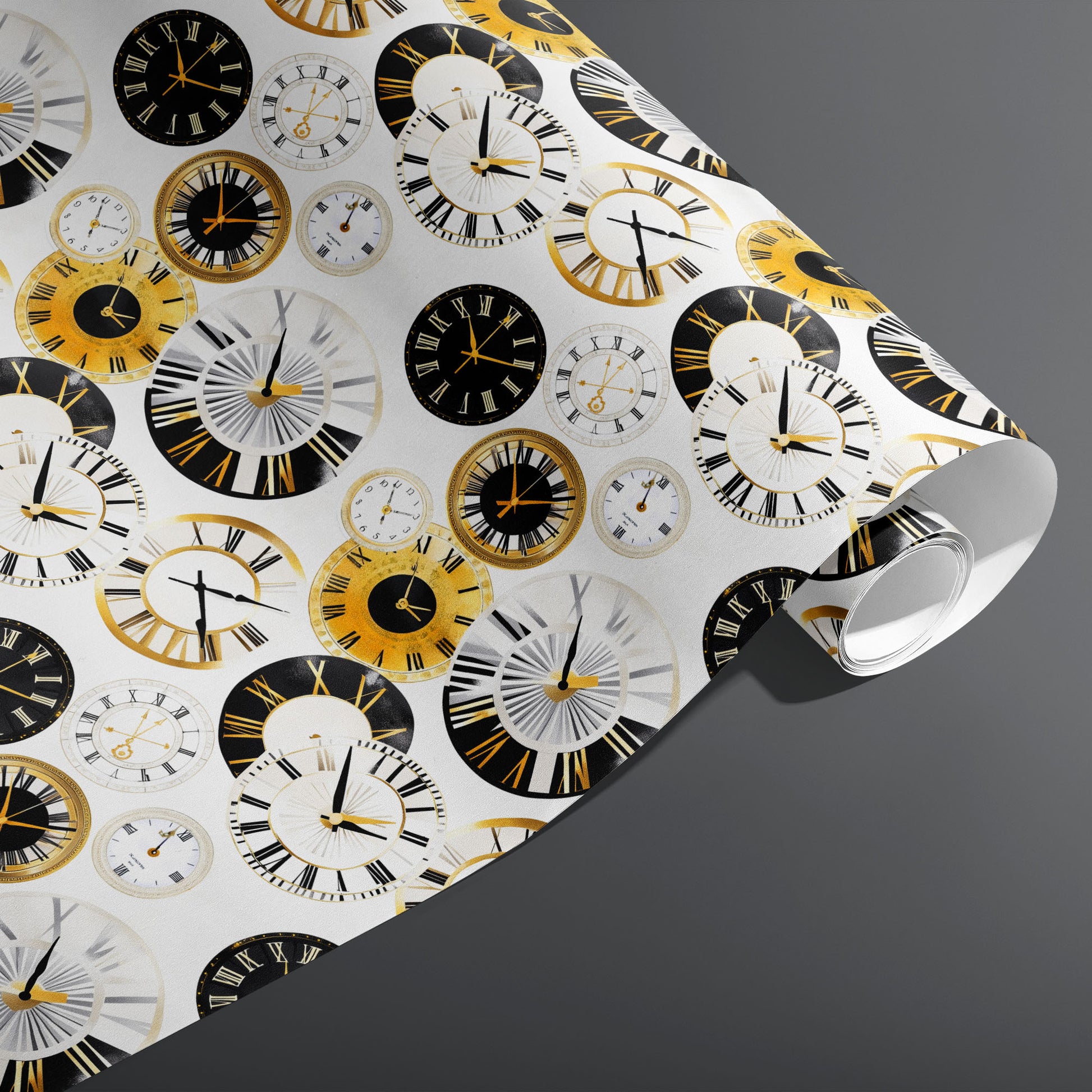A partially unfurled roll of Luxe Time wrapping paper showing gilded and black clock dials with Roman numerals on white, resting on a dark gray surface.