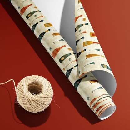 A partially unfurled roll of Vintage Bubbly with the white underside visible sits beside natural twine on a brick-red surface, revealing retro bottles and coupes on cream.