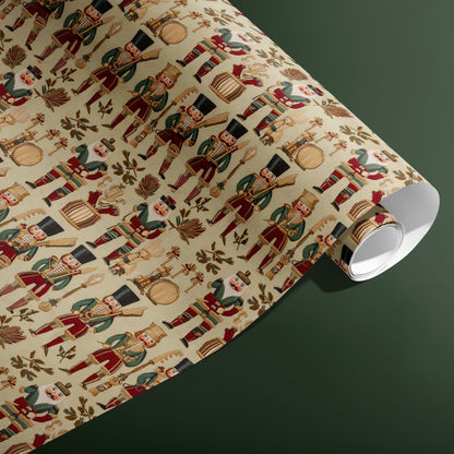 A partially unfurled roll of Heritage Nutcrackers displays classic nutcracker figures, drums, and foliage on a cream field against a deep green backdrop.