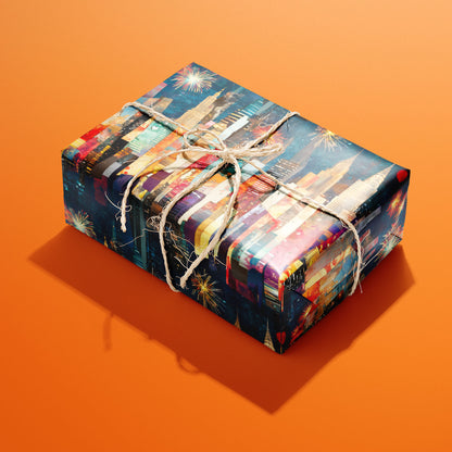 A single rectangular gift wrapped in Skyline Splendor and tied with natural twine highlights multicolor skyscrapers and fireworks on a starry navy ground against a bright orange backdrop.