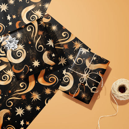 Two gifts wrapped in Golden Stardust—one with a silver bow, one tied with twine—rest on two matching sheets beside a twine spool on a warm peach background.