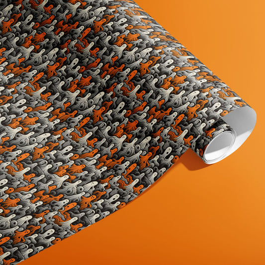 A partially unfurled roll of Cute Ghosts wrapping paper shows orange, white, and gray ghosts with flowing swirls on charcoal black against an orange background.