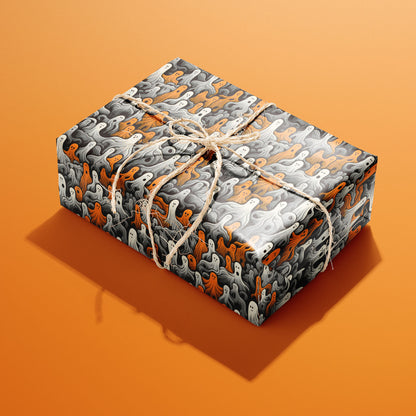 A single rectangular gift wrapped in Cute Ghosts paper and tied with natural twine features orange, white, and gray wavy ghosts on charcoal black, set on an orange background.