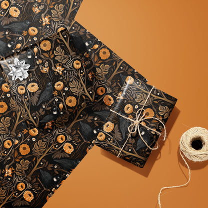 Two gifts wrapped in Autumn Floral—one with a silver bow and one tied with twine—rest on two unused sheets beside a twine spool on a warm rust surface, with painterly fall florals.