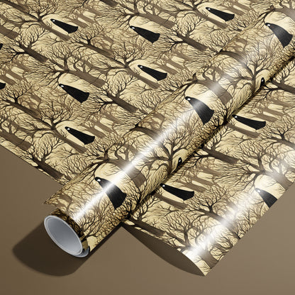 A roll of Silent Forest wrapping paper rests on an unrolled sheet, featuring leafless trees and cloaked figures on a parchment-tan ground, styled on a warm brown surface.