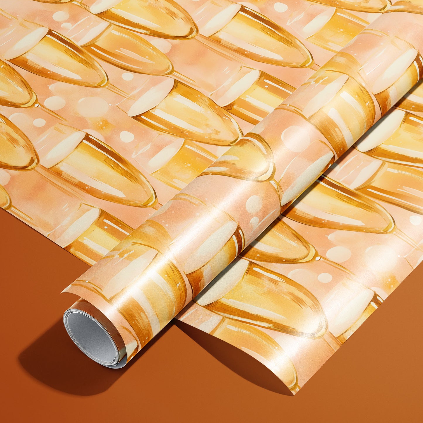 A roll on an unrolled sheet of Shimmering Sips wrapping paper with watercolor champagne flutes and fizzy bubbles on a peach ground, set on a rich copper-orange background.