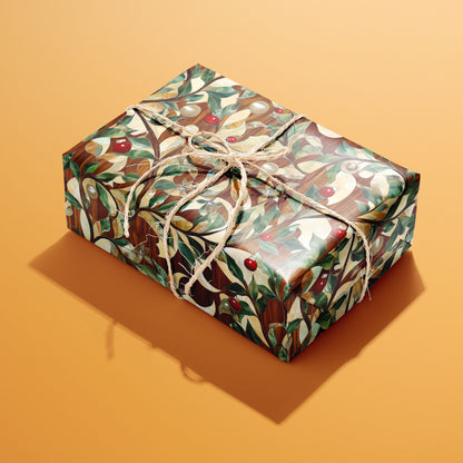 A single rectangular gift wrapped in Gilded Greenery paper, its gilded vines, green leaves, and red berries gleaming, tied with natural twine on a warm orange background.