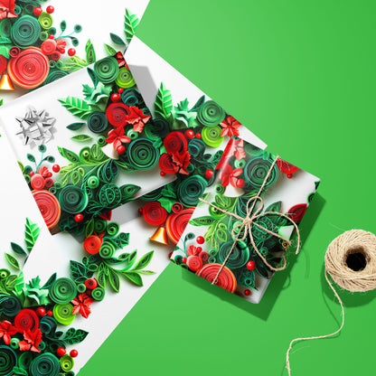 Two gifts wrapped in Festive Quills—one with a silver bow and one tied with twine—rest on two unused sheets beside a twine spool on a bright green surface, with quilled holly and berries on white.