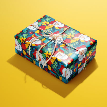 A single rectangular gift wrapped in Christmas Cutouts and tied with natural twine, the papercut Santas, holly, and ornaments vivid on deep teal against a yellow backdrop.